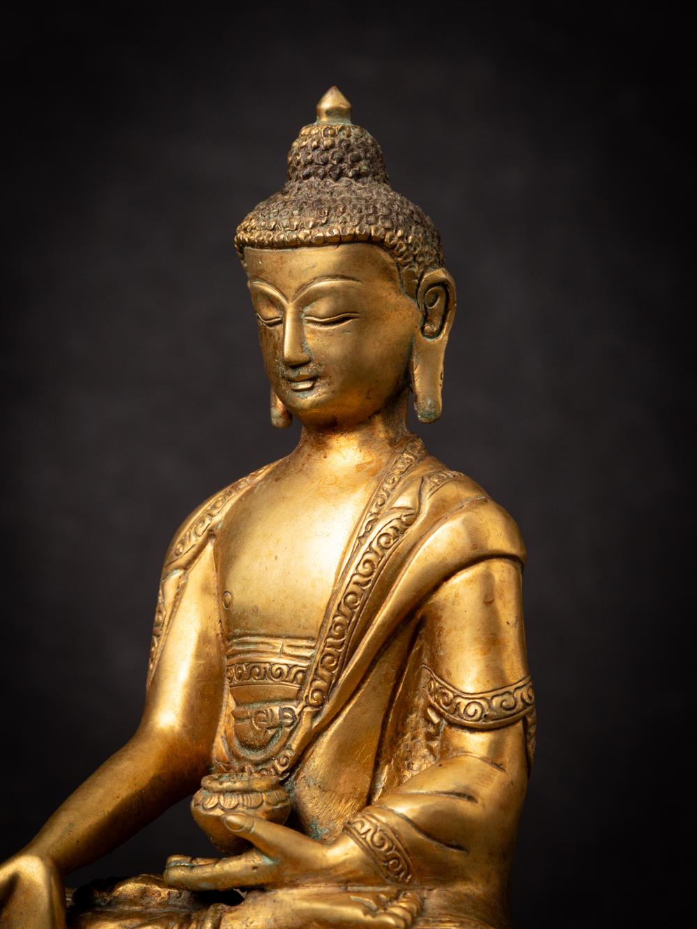 Mid-20th century old bronze Nepali Buddha statue in Varada Mudra 1
