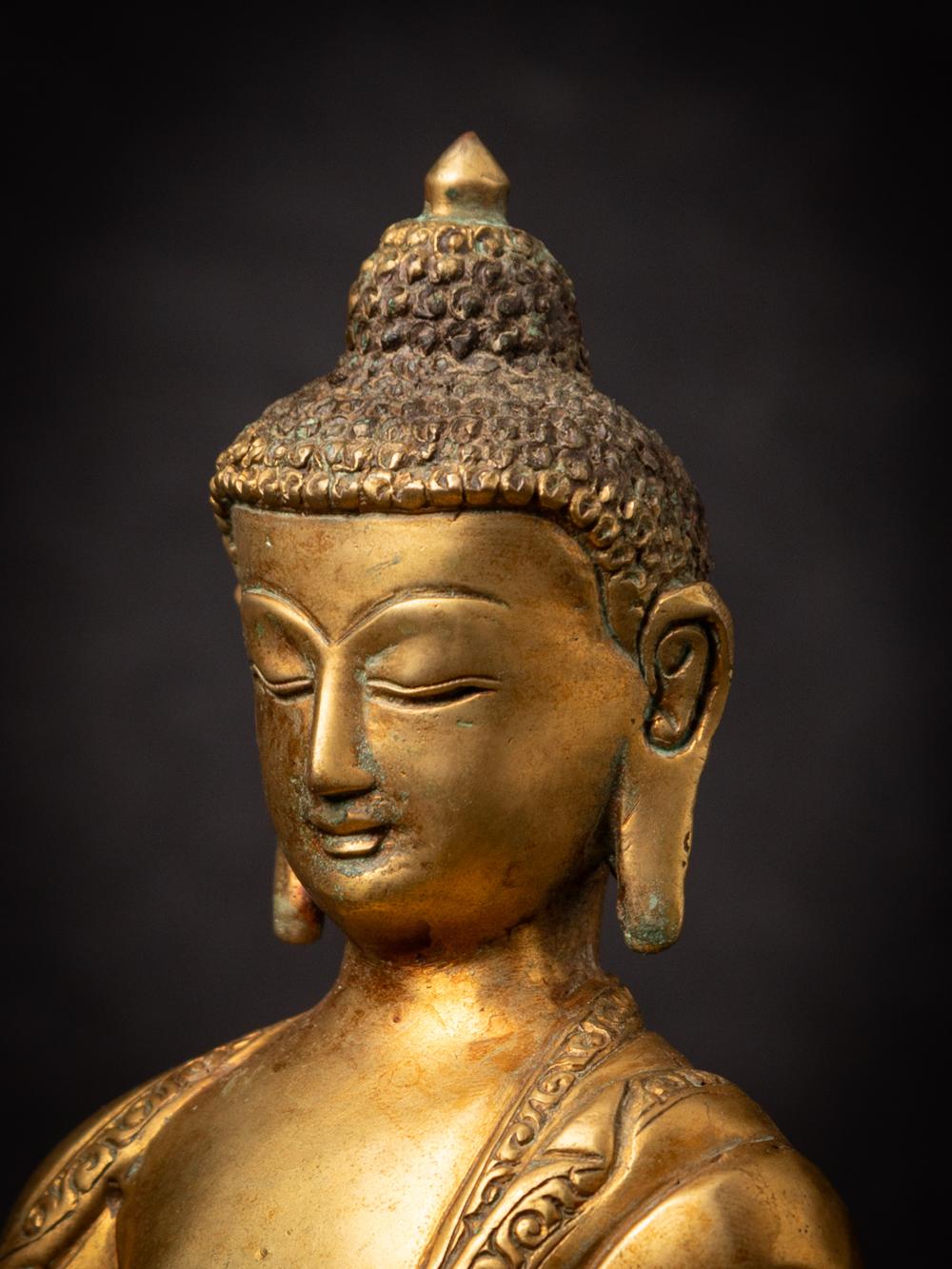 Mid-20th century old bronze Nepali Buddha statue in Varada Mudra 2