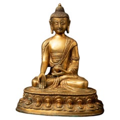 Mid-20th century old bronze Nepali Buddha statue in Varada Mudra