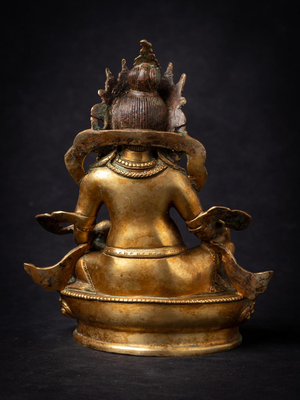 Mid-20th century old bronze Nepali Kuber statue fire gilded with 24 krt. gold In Good Condition For Sale In DEVENTER, NL