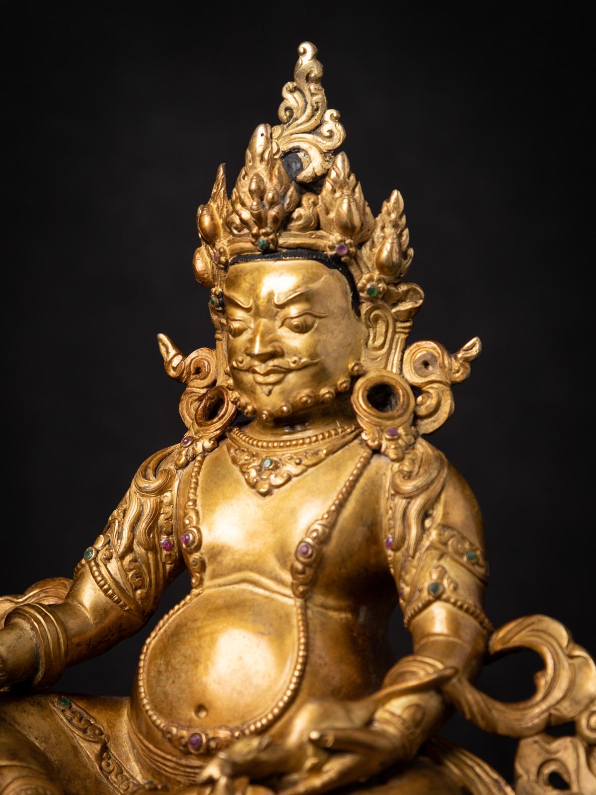 20th Century Mid-20th century Old bronze Nepali Kuber statue fire gilded with 24 krt. gold
