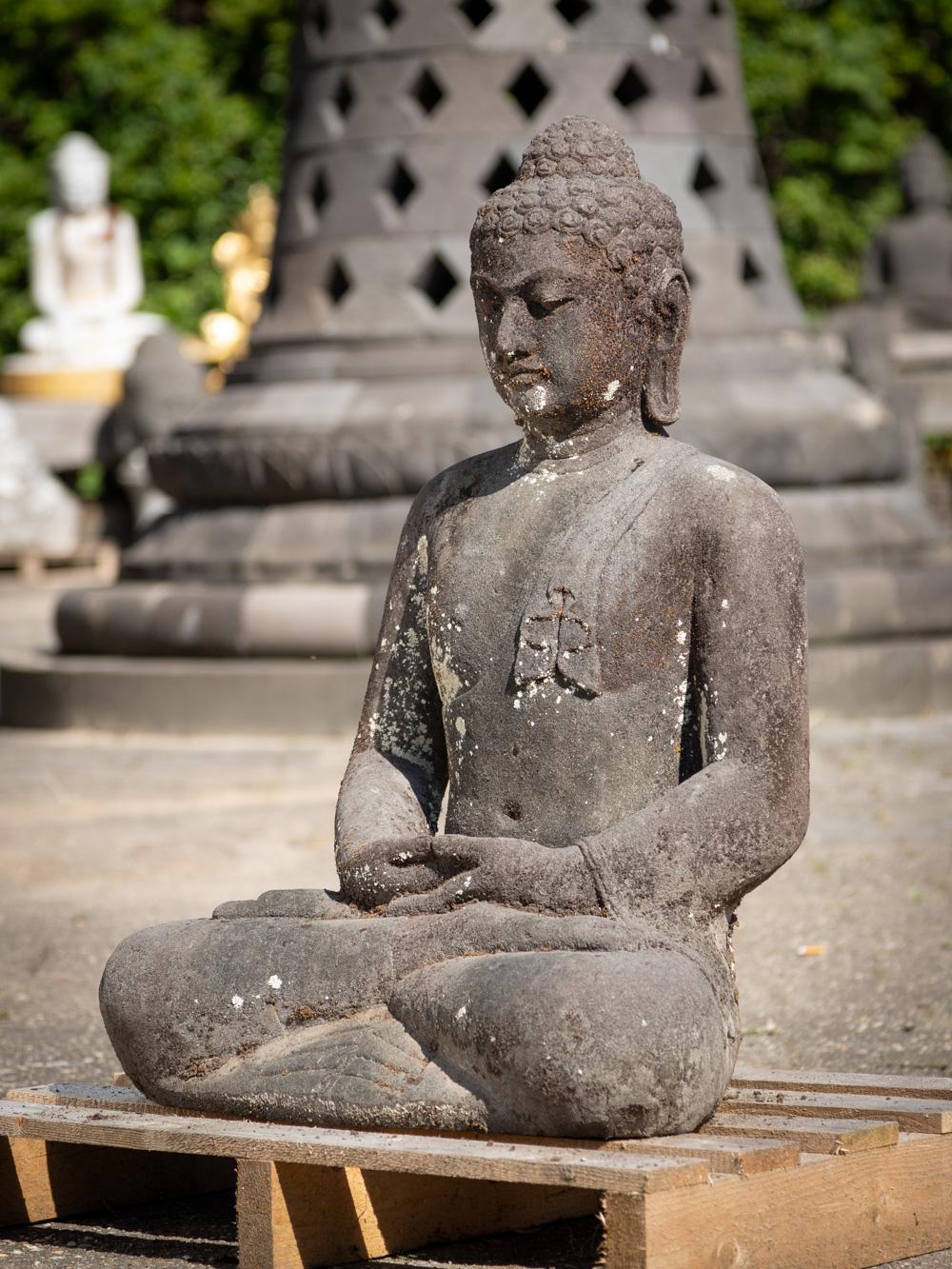 The old lava stone Buddha statue from Indonesia is a remarkable piece of art and spirituality. Crafted from lavastone, a material that holds both cultural and geological significance in Indonesia, this statue stands at an impressive height of 84 cm,