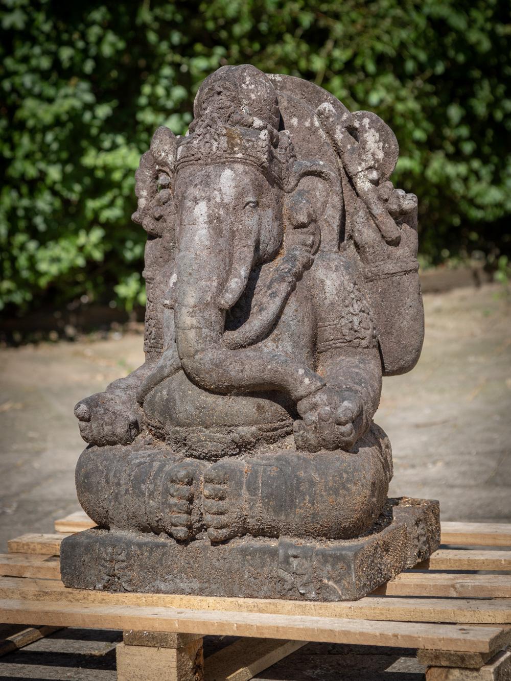Experience the captivating charm and spiritual aura of this Old Lavastone Ganesha Statue. Carved from lavastone, this exquisite piece stands at an impressive height of 60 cm, making it a striking centerpiece for any space. With dimensions of 37 cm