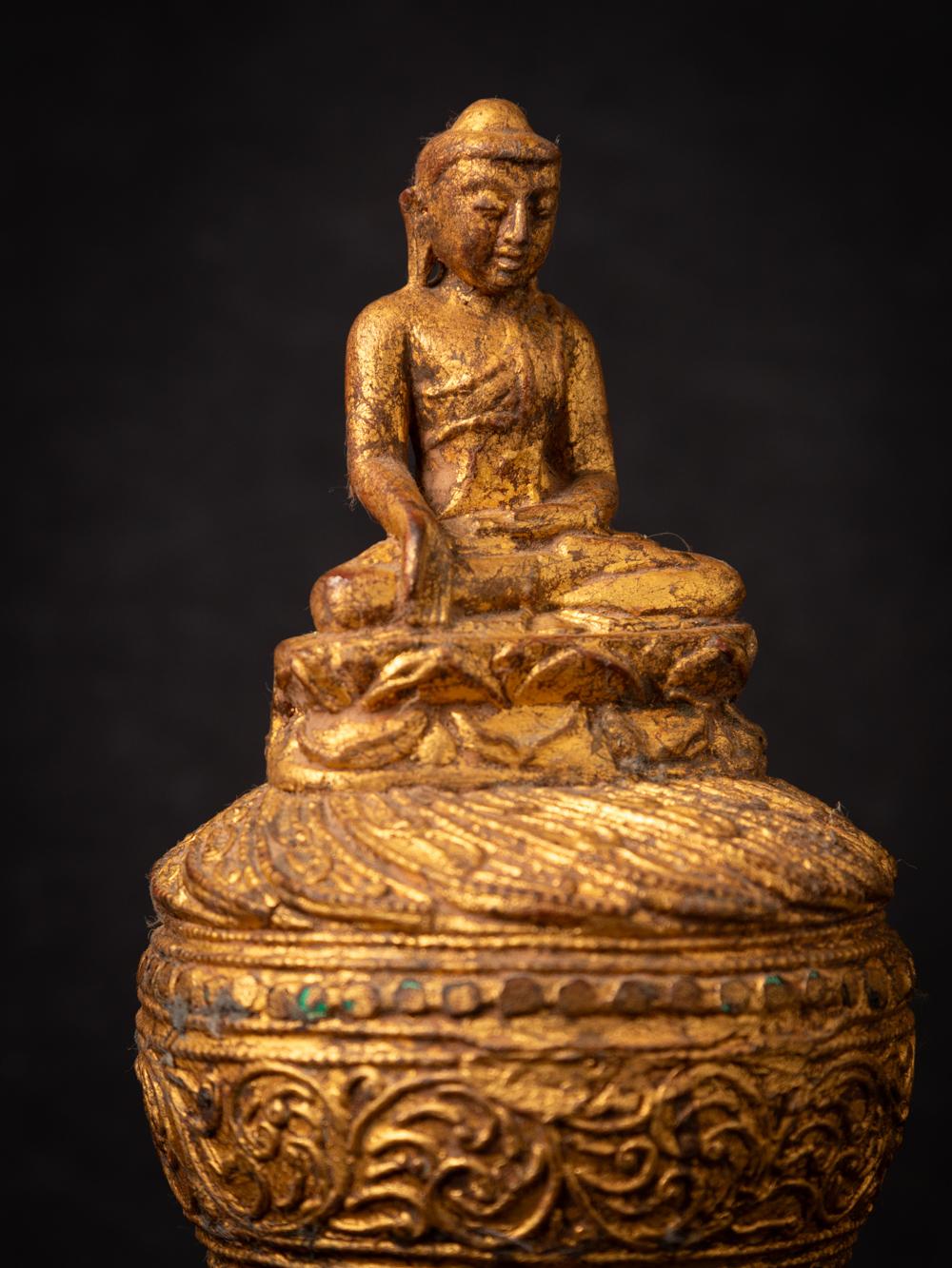 This old wooden Burmese Monk statue is a testament to the artistic traditions and spiritual heritage of Burma (now Myanmar). Crafted from wood, this statue stands at a height of 25 cm with dimensions of 11.5 cm in width and 11.5 cm in depth. Dating