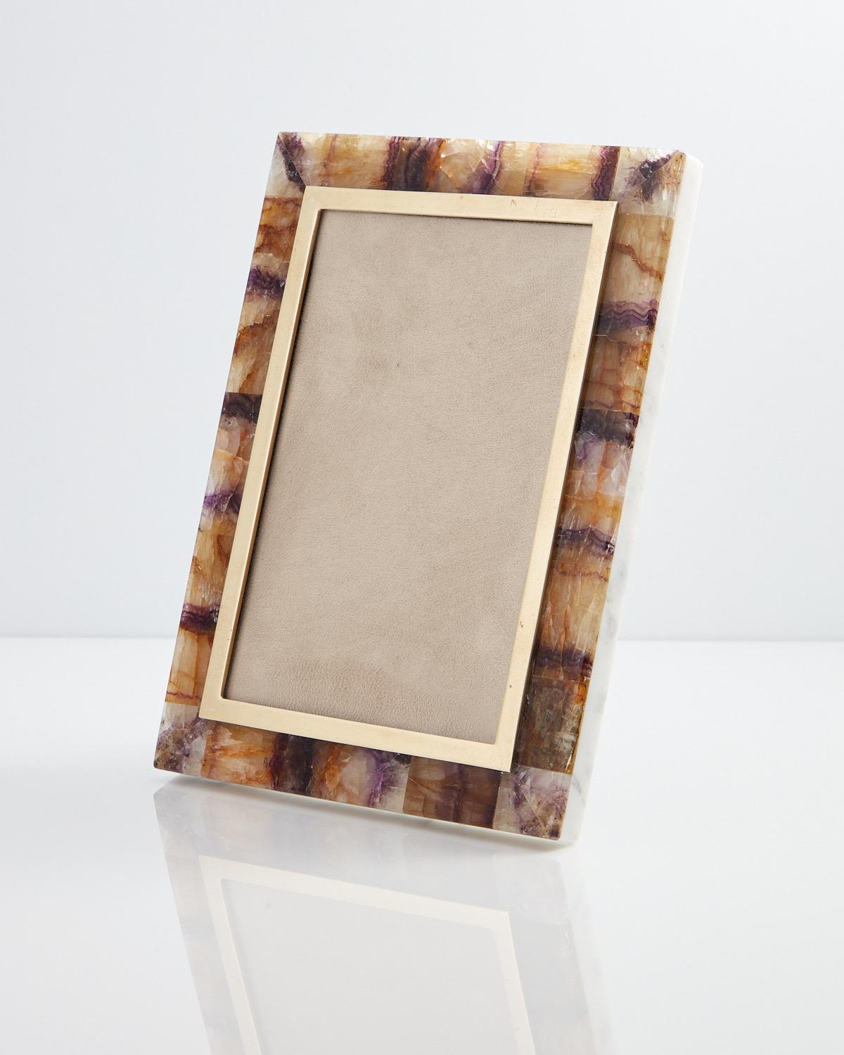Mid 20th Century Onyx photograph frame with Blue John decoration 
Date Circa 1960 
Origin England 

A wonderful photograph frame with a great contrast of Materials. The white onyx works well with the Rare Blue John applied boarder.

Dimensions;