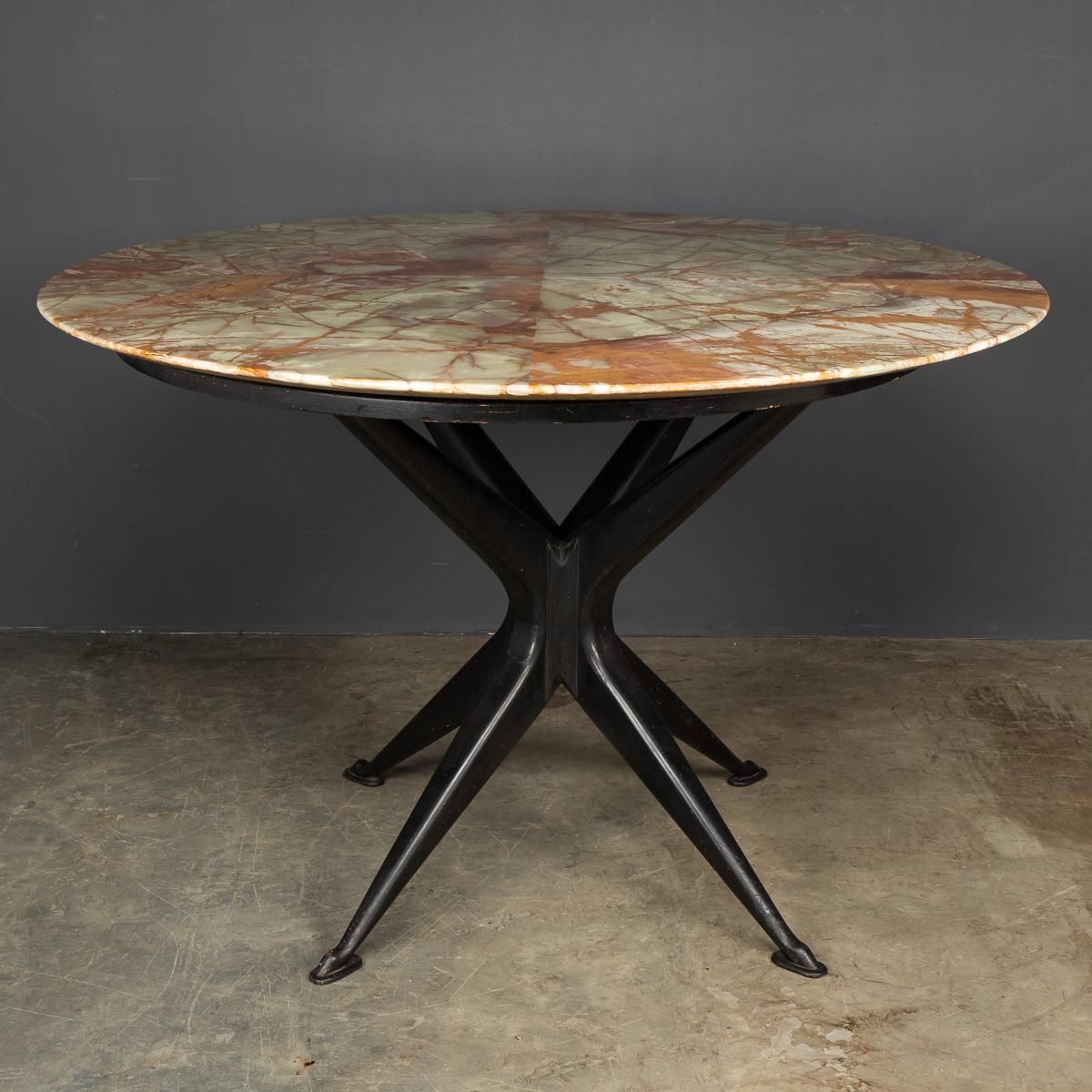 Mid-20th century Onyx top table on an ebonised base. A truly striking piece of designer furniture.

Condition
In great condition - wear consistent with age.

Size
Diameter: 120cm
Height: 78cm.