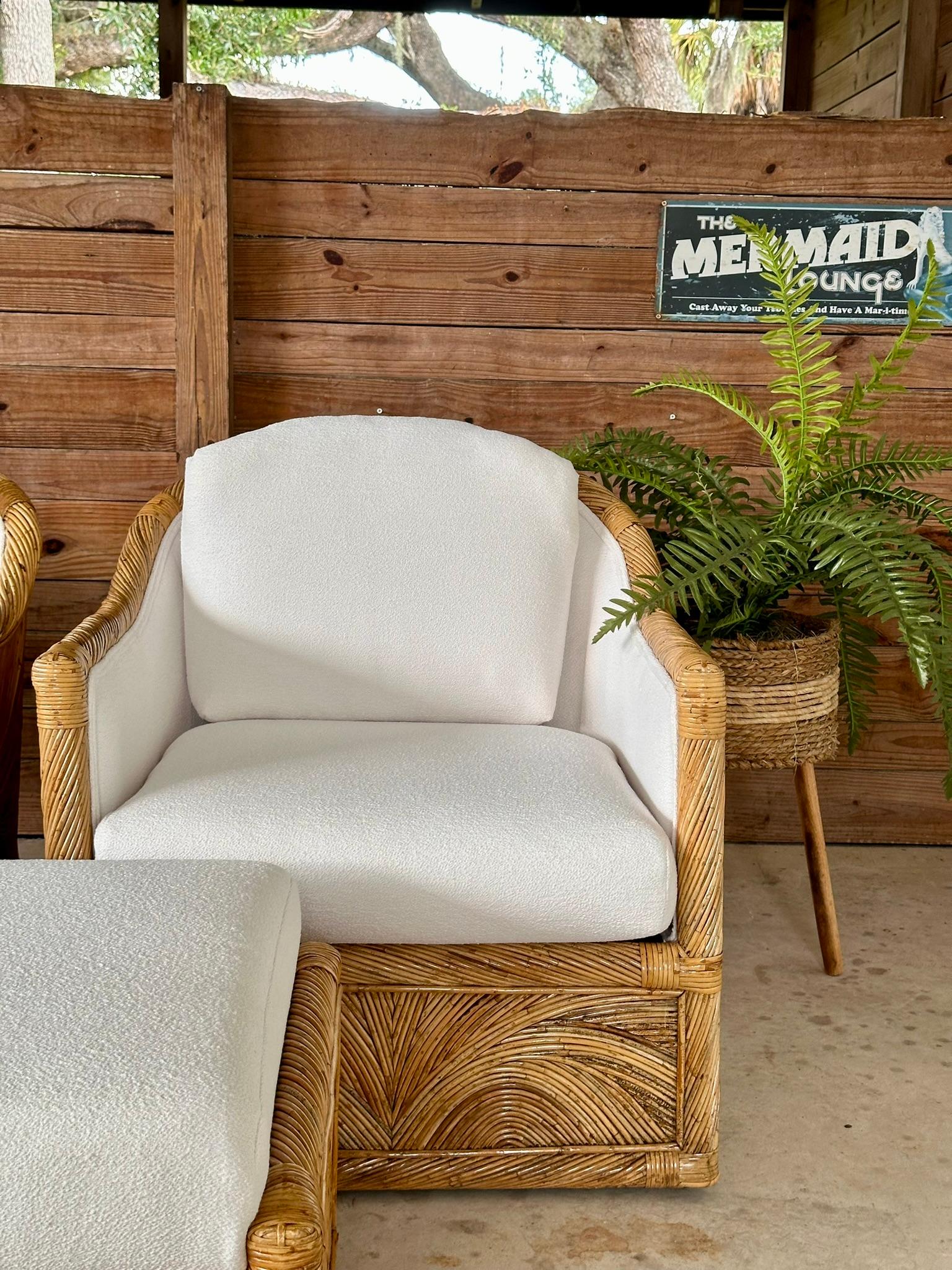 Add a touch of vintage charm to your space with this exquisite pair of Mid-20th century Organic Modern pencil rattan tub chairs and matching ottoman.
Each piece has been meticulously refinished and custom upholstered in a textured Sunbrella fabric,