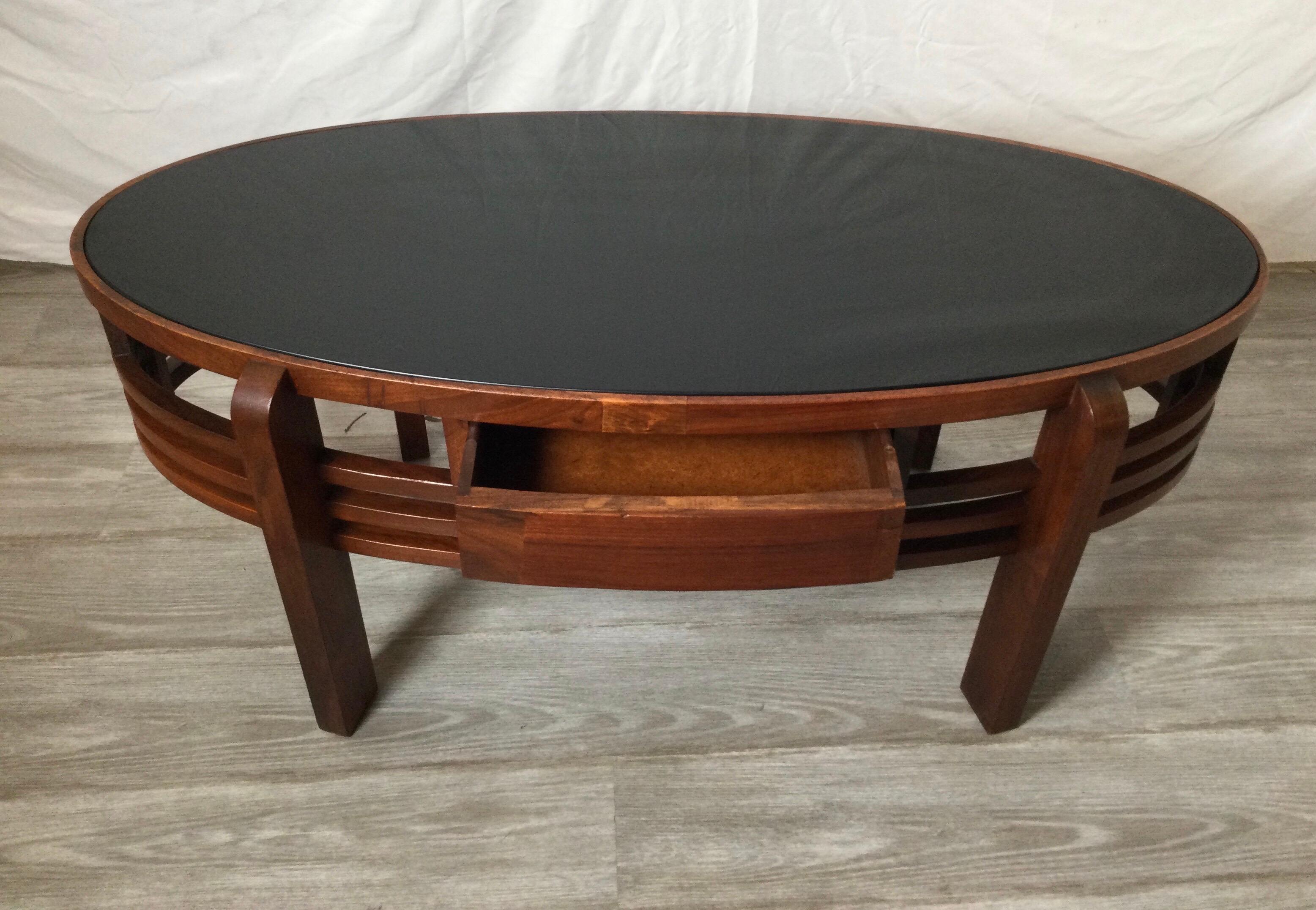 American Mid 20th Century Oval Walnut Cocktail Table with Black Glass Top