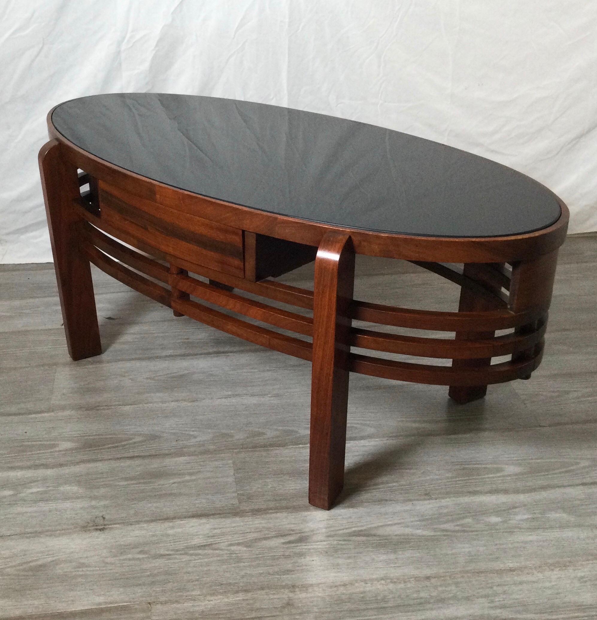 Mid 20th Century Oval Walnut Cocktail Table with Black Glass Top 1