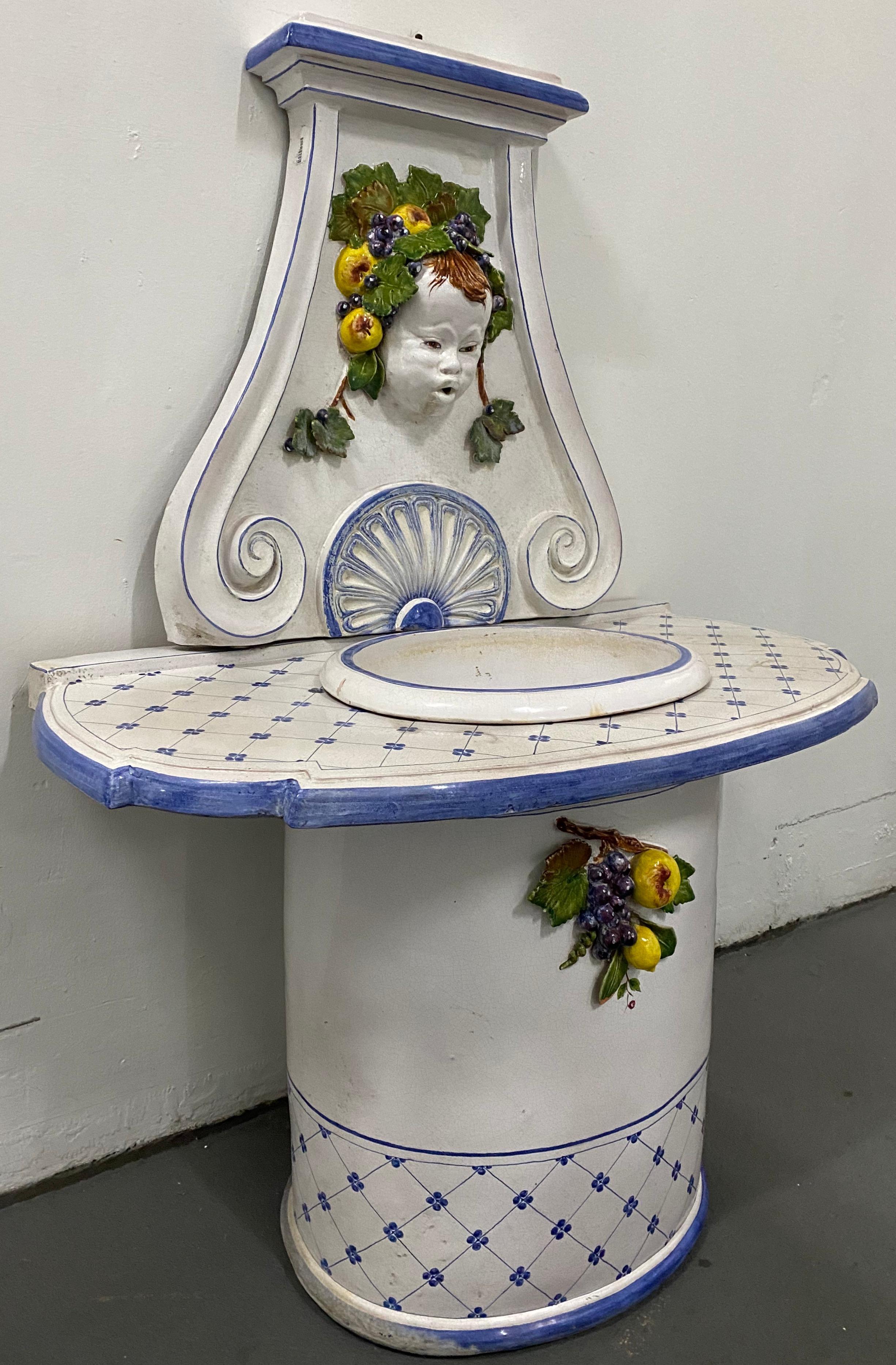 Mid-20th century painted and glazed Italian Garden Fountain, circa 1950

Classic Italian fountain with the face of a cherub surrounded by grapes and pears

Dimensions 42