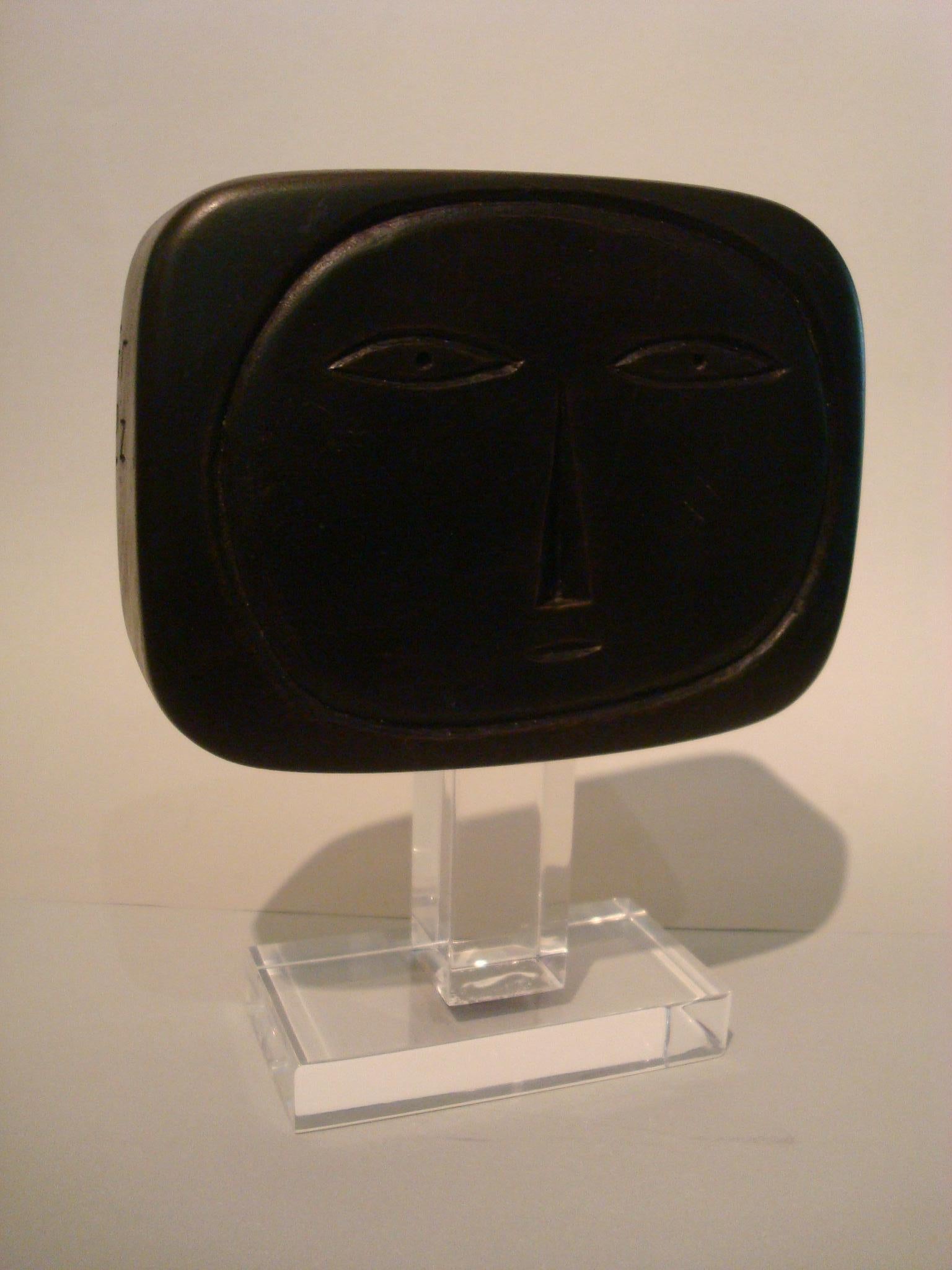 Mid-20th century wooden face sculpture 1950s.
Signed L.N. 1951
Painted wood sculpture, signed and dated on left side. Supported on an acrylic base.

