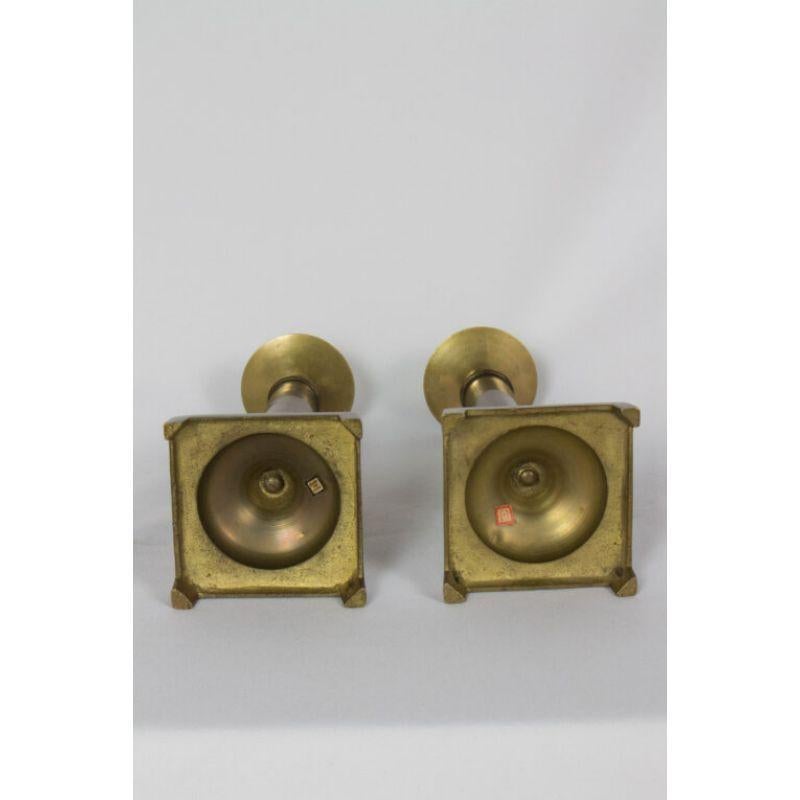 Brass candlesticks. Solid brass, with antiqued finish. Round column with a square base. Made in India

Dimensions:
Height: 11?
Width: 3.5?
Depth: 3.5?.