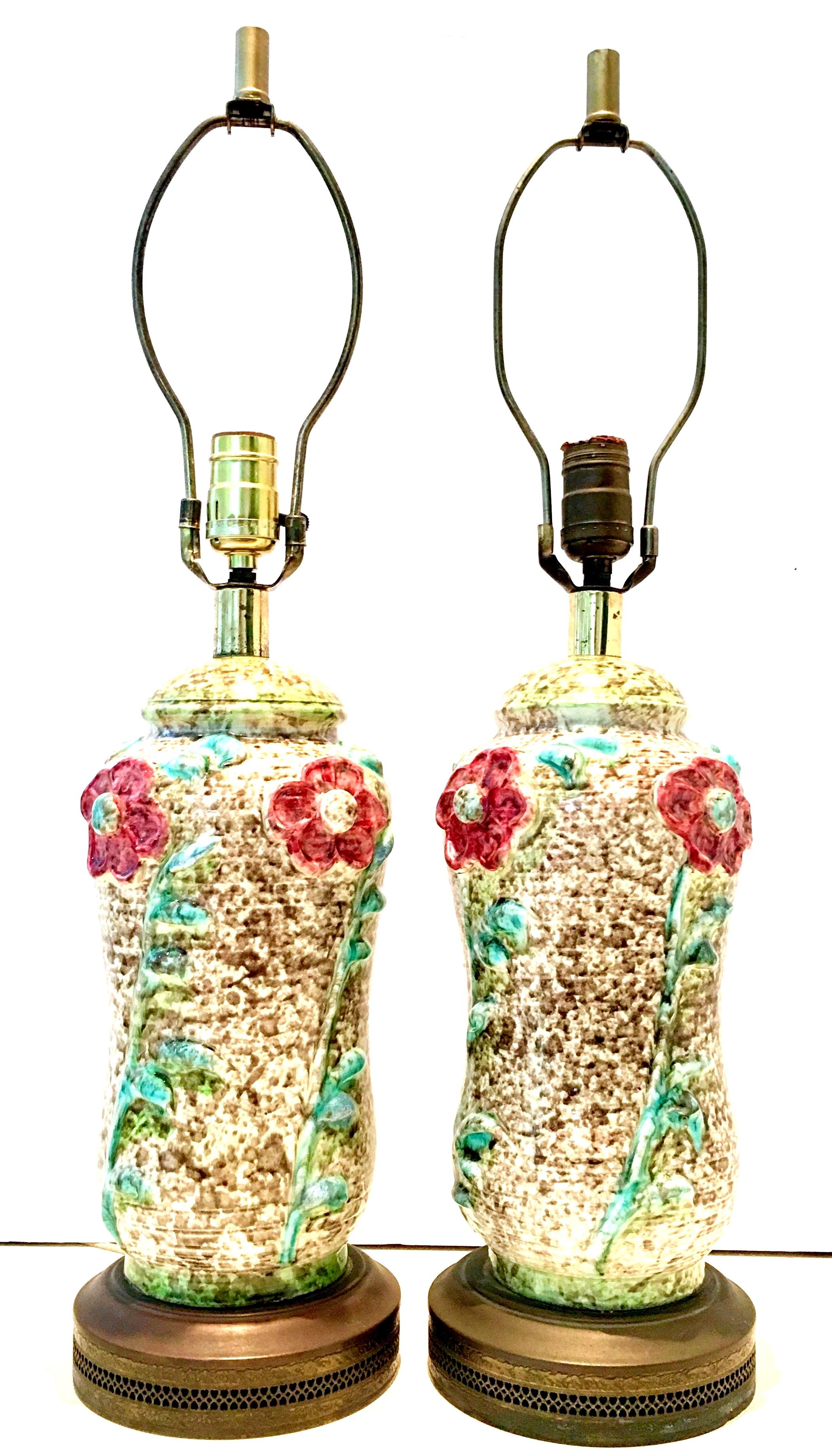 Mid-20th century Art Nouveau pair of ceramic glaze and gilt brass floral motif table lamps. These most unique, whimsical and extraordinary handmade lamps feature a white and wheat ground with textured, raised and incredibly executed floral motif in