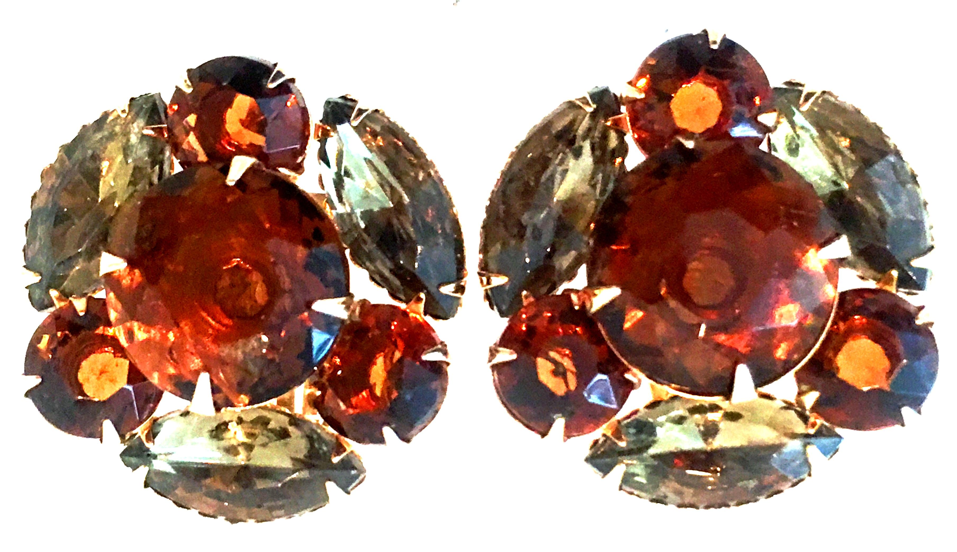Mid-20th Century Pair Of Gold & Austrian Crystal Dimensional Earrings. These finely crafted gold plate earrings feature fancy prong set brilliant cut and faceted amber and topaz Austrian crystal stones.