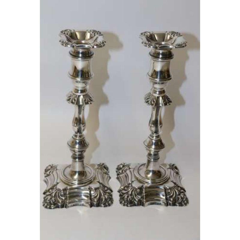 A fine pair of heavy gauge silver candle sticks.

This good quality pair of large English silver candlesticks are beautifully made in an early 18th-century style. They are of a superior heavy gauge silver, beautifully crafted with separate cast