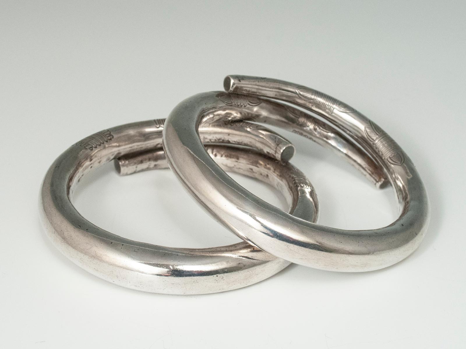 Tribal Mid-20th Century Pair of Hollow Silver Incised Bracelets, China For Sale