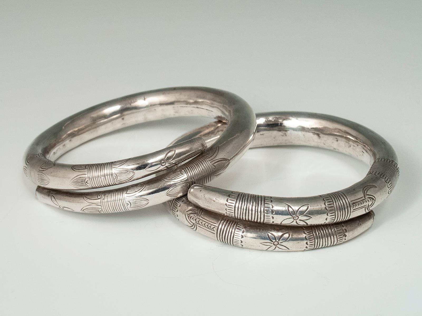 Chinese Mid-20th Century Pair of Hollow Silver Incised Bracelets, China For Sale