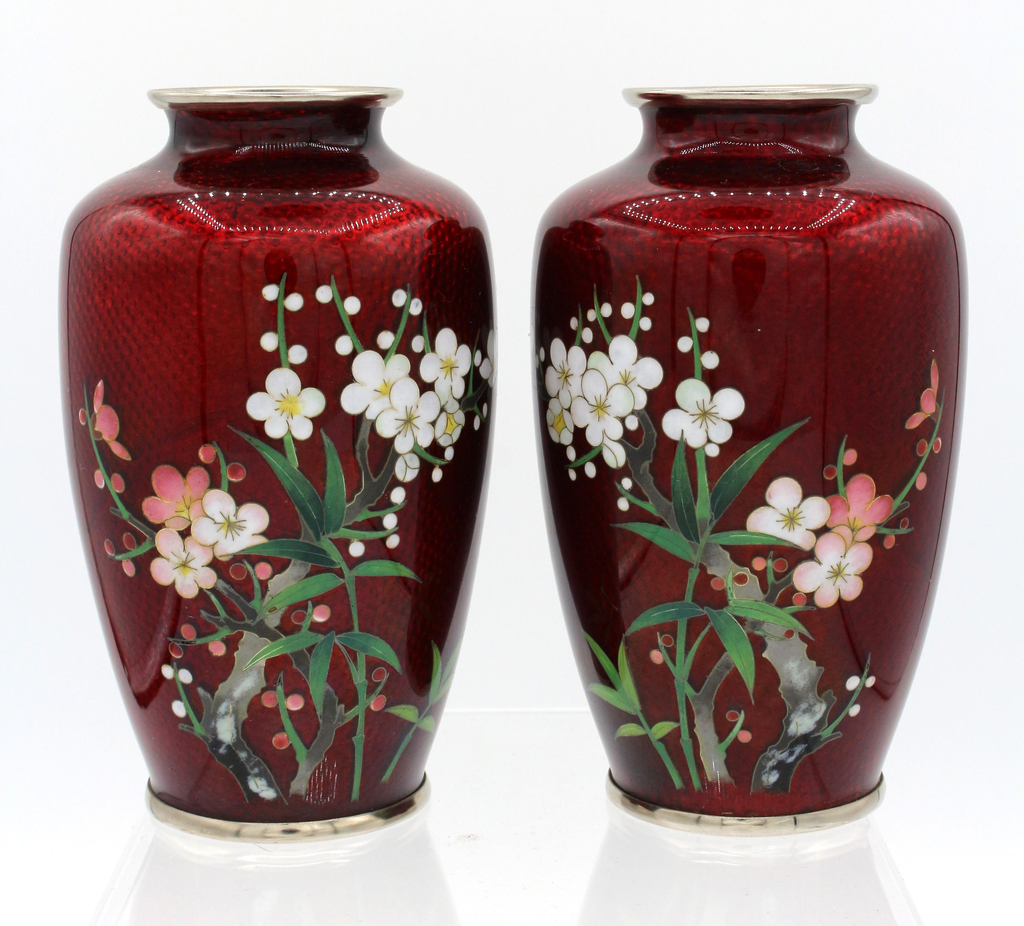 Mid-20th century pair of cloisonné vases, Japanese. Ginbari pigeon blood red with silver wires & mounts. Fine shading in the prunus & bamboo. Showa era. A mirrored, or facing, pair.
4 5/8