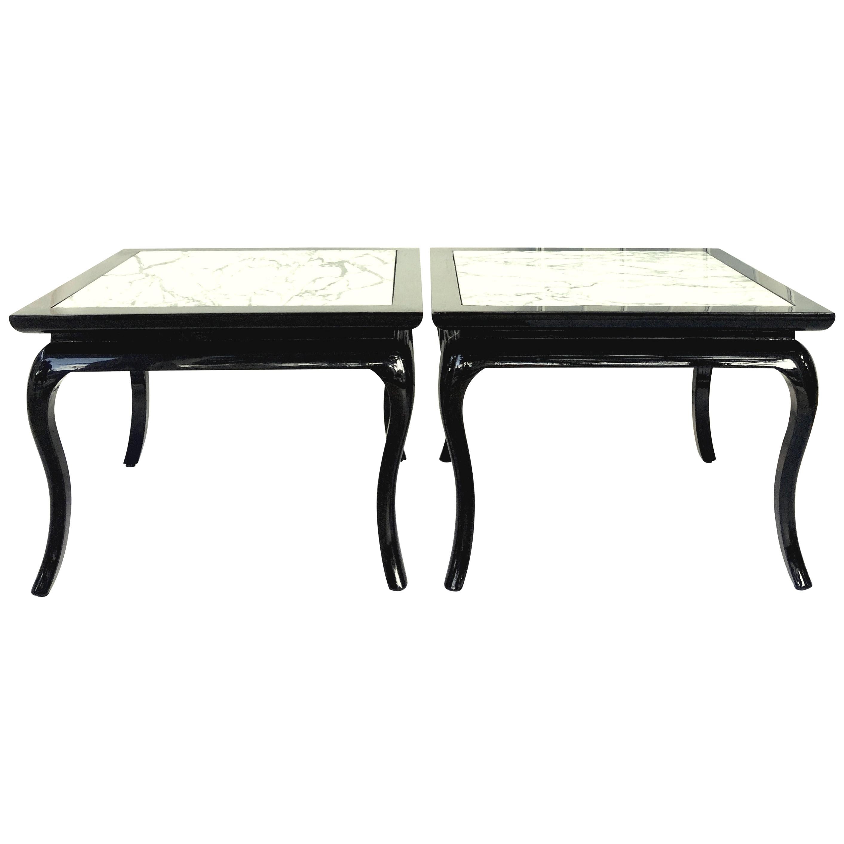 Mid-20th century pair of Hollywood Regency style maple black lacquer and polished Carrara marble inset top side tables. These finely crafted, substantial side tables have been newly and professionally lacquered to a high gloss black finish. The