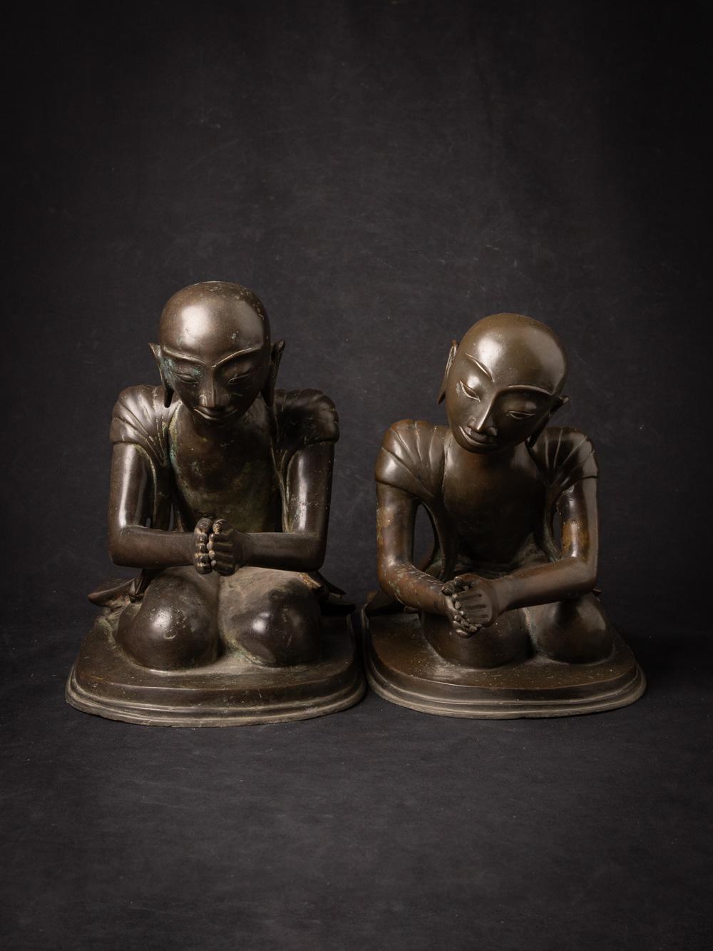 The pair of old bronze Burmese Monk statues is a captivating and culturally rich ensemble that offers a glimpse into the spiritual and artistic heritage of Burma. Crafted from bronze, these statues stand at a height of 29 cm, with measurements of 21