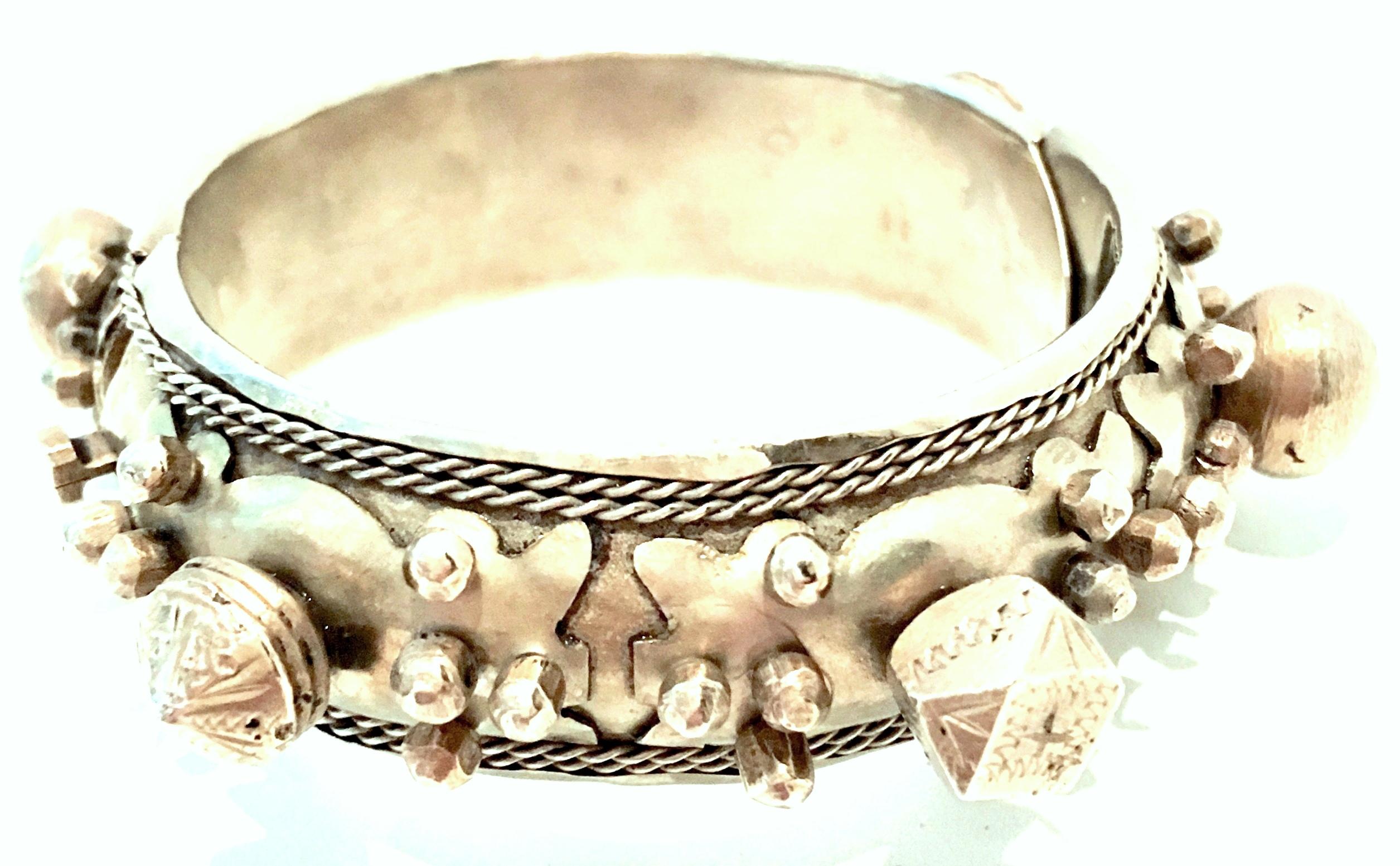 Mid-20th Century Rare Pair Of Old Silver Rajasthan Tribal Style Clamper Bangle Bracelets. These finely crafted and chunky bracelets feature a geometric raised and applied carved pattern. This pair of for the most part, identical bracelets have a
