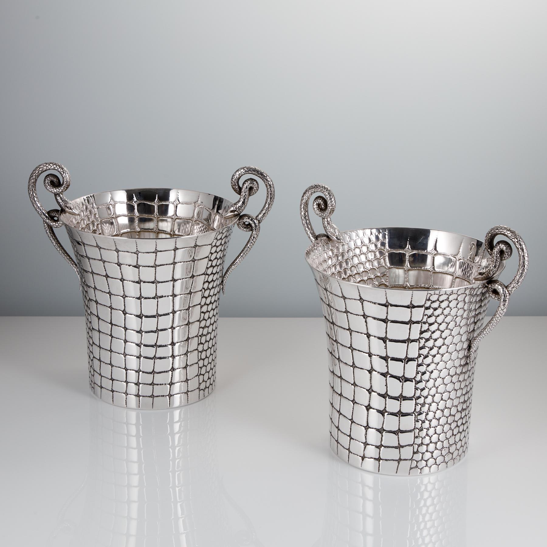 Discover a remarkable pair of mid-20th century Silver Champagne Coolers, hand-embossed with luxurious crocodile skin by master silversmith Paolo Scavia from Valenza, Italy, circa 1945-1950.

With a timeless design, these coolers are not only