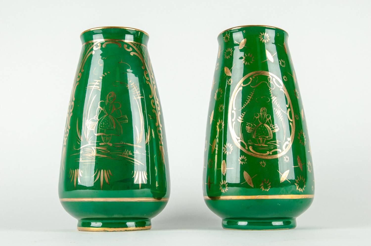 Mid-20th century pair porcelain decorative vases / pieces with exterior gilt design details. Each vase is in great vintage condition. Maker's mark undersigned & numbered. Each vase stands about 10 inches high x 5 inches diameter.