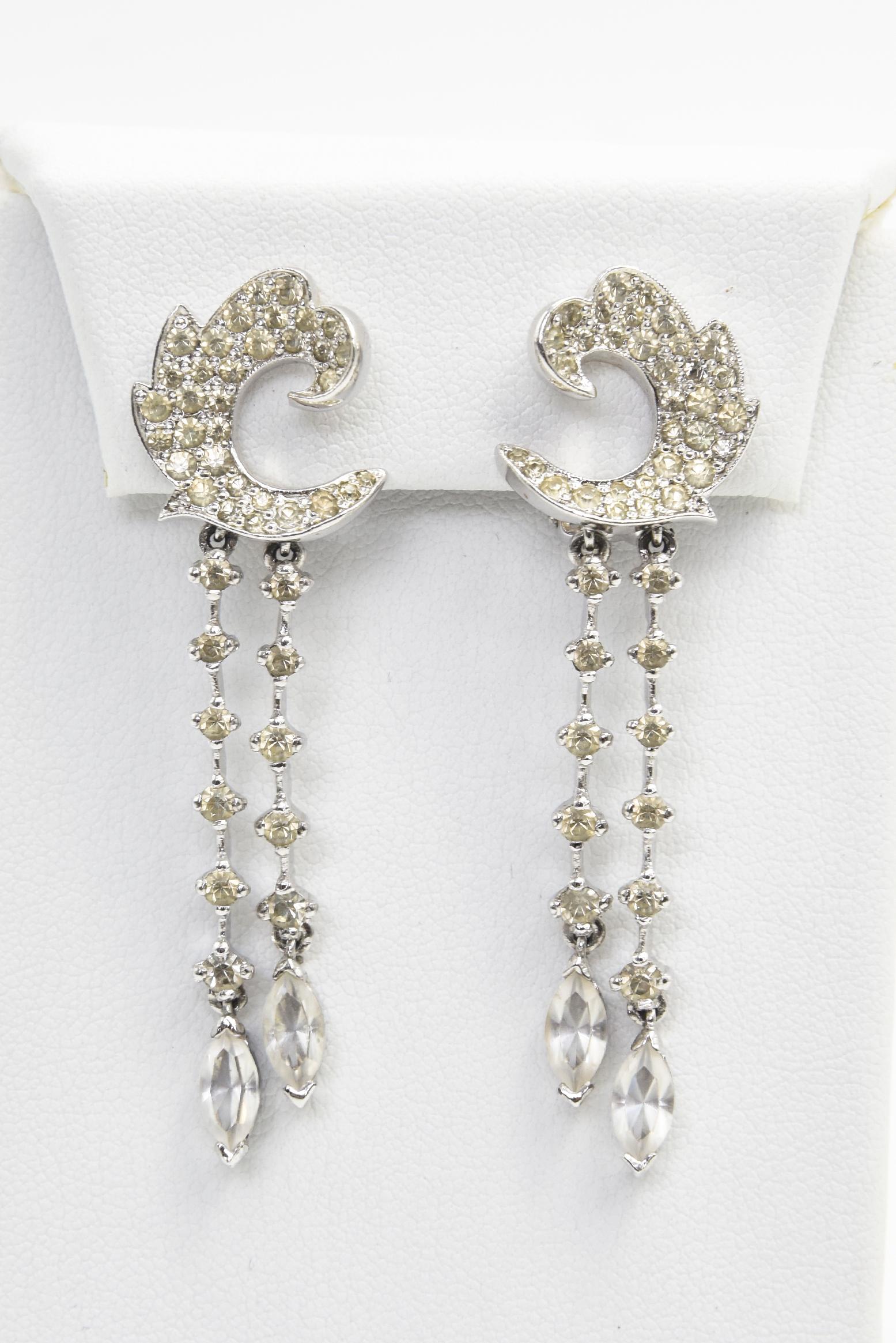 Panetta is truly one of the best of the great pretenders. His costume pieces are finely made to give you the look of real at the price of costume.  In these mid 20th century clip on earrings Panetta uses clear crystals to create a fake diamond drop