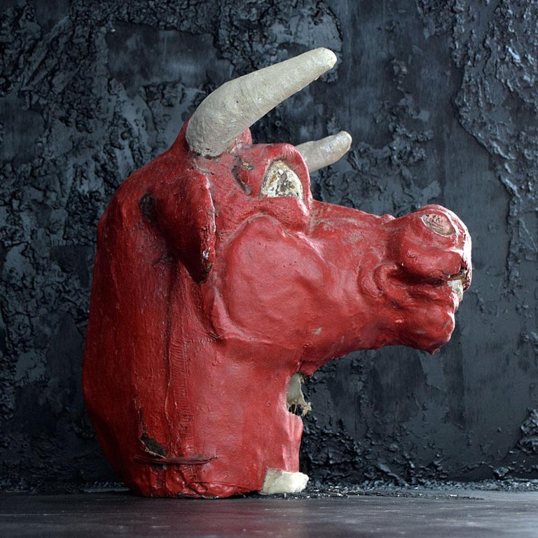 Mid-20th century papier mache bull carnival mask
We are proud to offer a quirky mid-20th century papier mache carnival bulls mask. Made from a canvas and heavy layered Papier Mache material, painted with thick red paint makes this object very