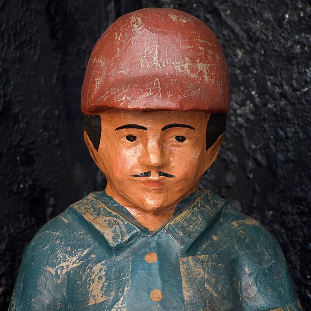 Mid-20th century papier mâché fairground amusement figure
We are proud to offer a highly decorative mid-20th century papier mâché fairground amusement figure. Depicting a horse racing jockey holding his racing saddle matt and side bag. Stood on a