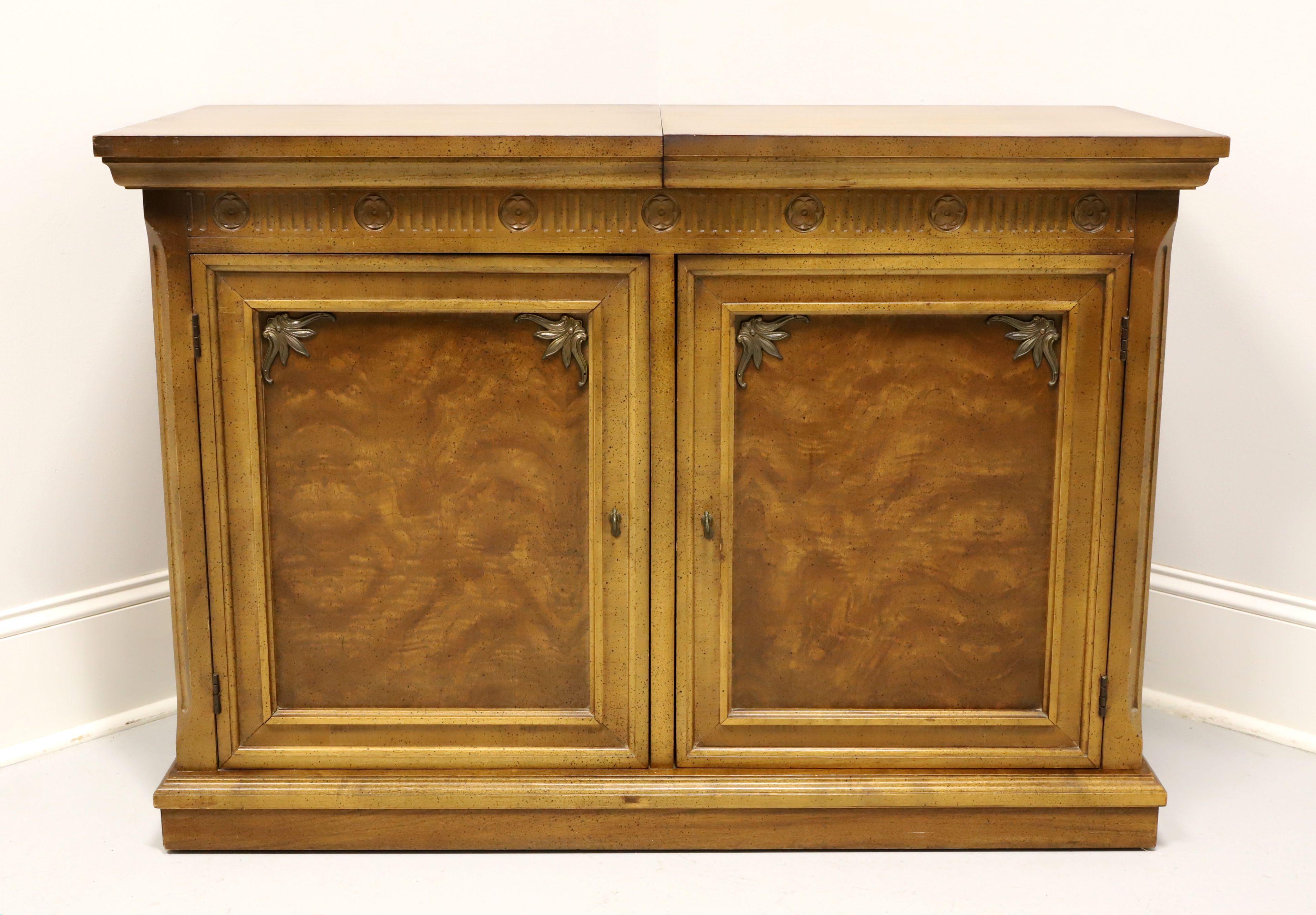 A Neoclassical style server, unbranded, similar in quality to Thomasville or Tomlinson. Pecan, or similar nutwood, recessed door panels with wood grain detail & brass accents, brass hardware and hard composite surface under slide out top. Features