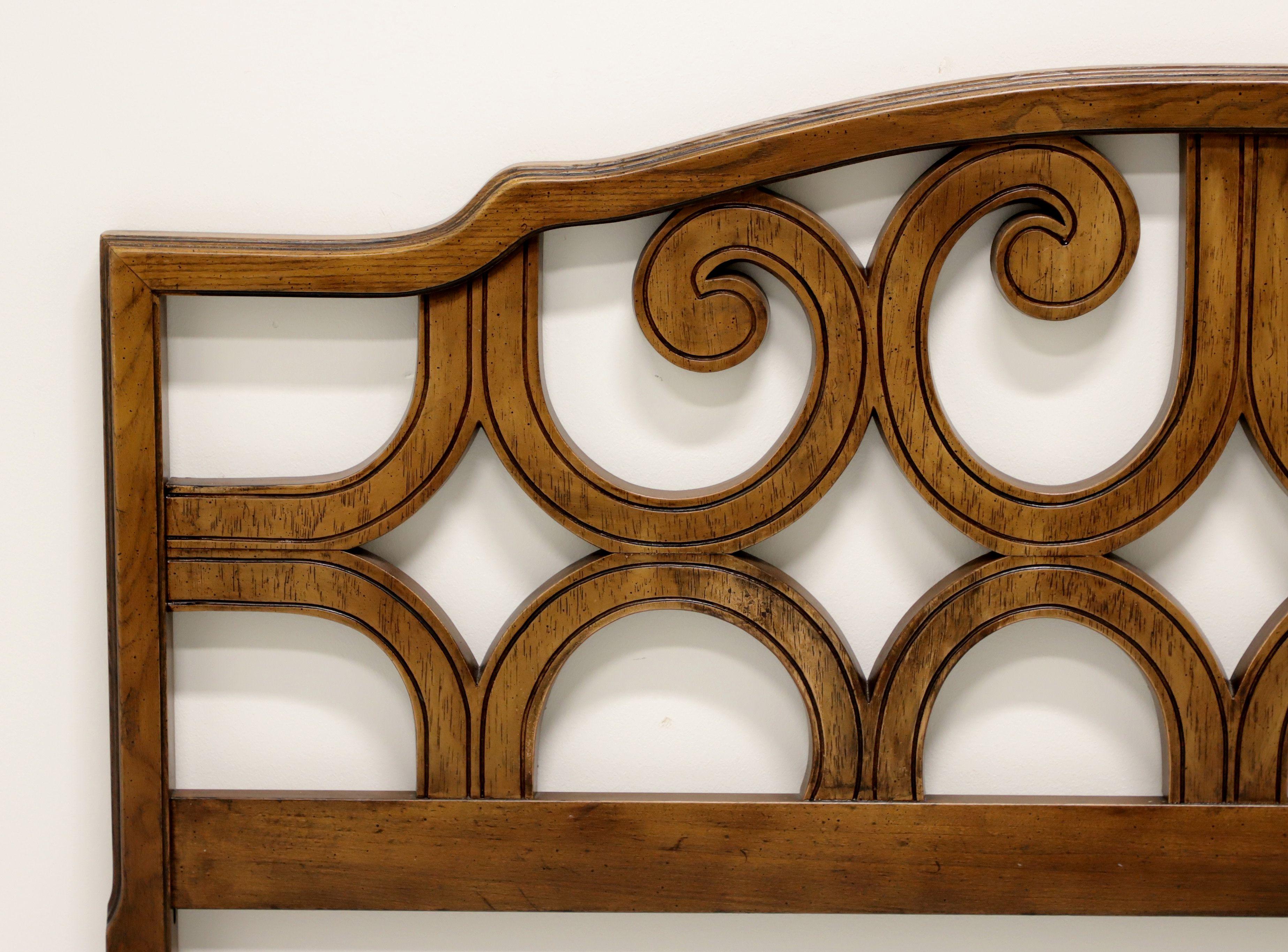 A Spanish style full size headboard, unbranded, similar quality to Drexel. Solid pecan with arched top and decorative open carvings. Made in the USA, in the mid 20th century.

Measures: 59.5 W 1.75 D 40.5 H

Exceptionally good condition with