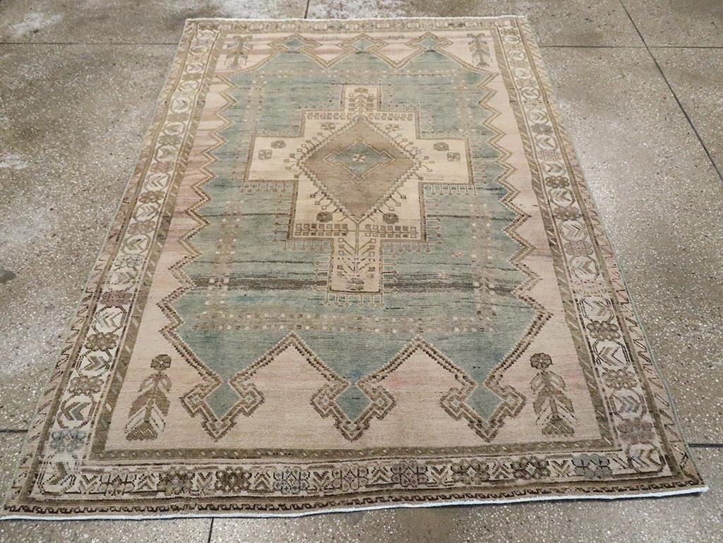 A vintage Persian Afshar accent rug handmade during the Mid-20th century.

Measures: 4' 10