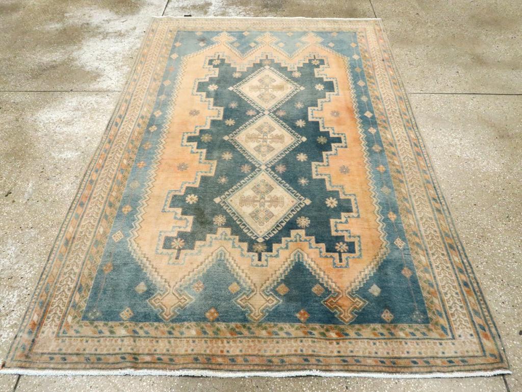 A Wool pile with symmetric knots on a cotton foundation. Older Afshars were woven on wool, but in the 1920s, there was a shift to the more functional cotton. This transitional scatter features the characteristic pattern of superimposed panels or