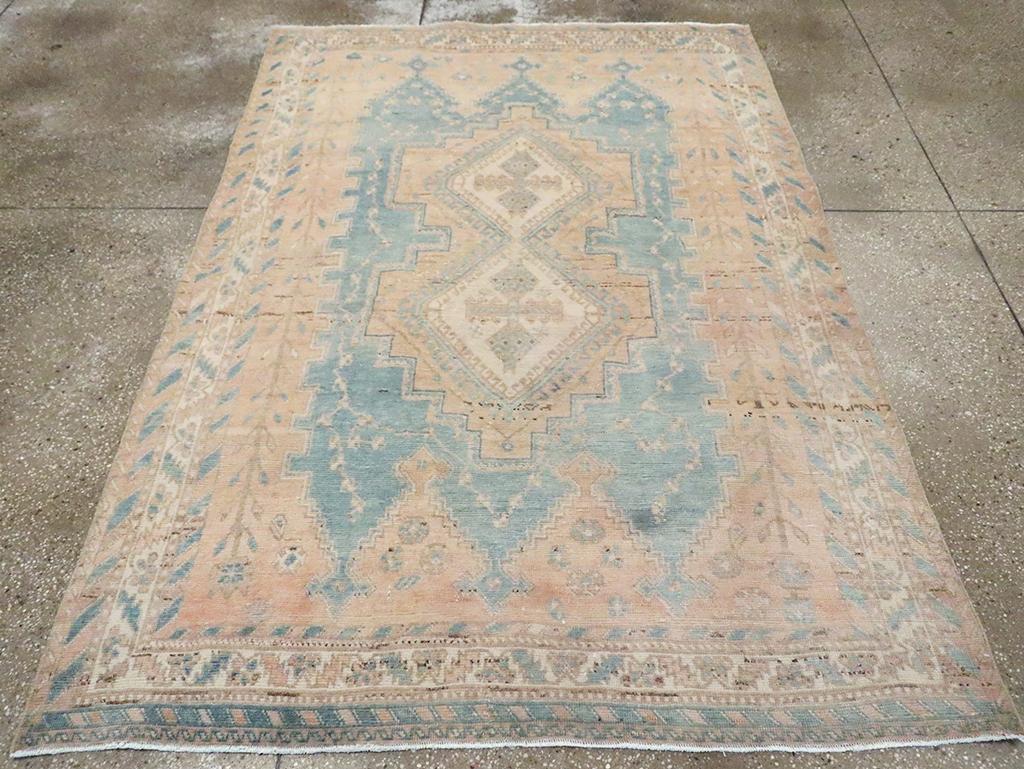 A vintage Persian Afshar accent rug handmade during the Mid-20th century.

Measures: 5' 1