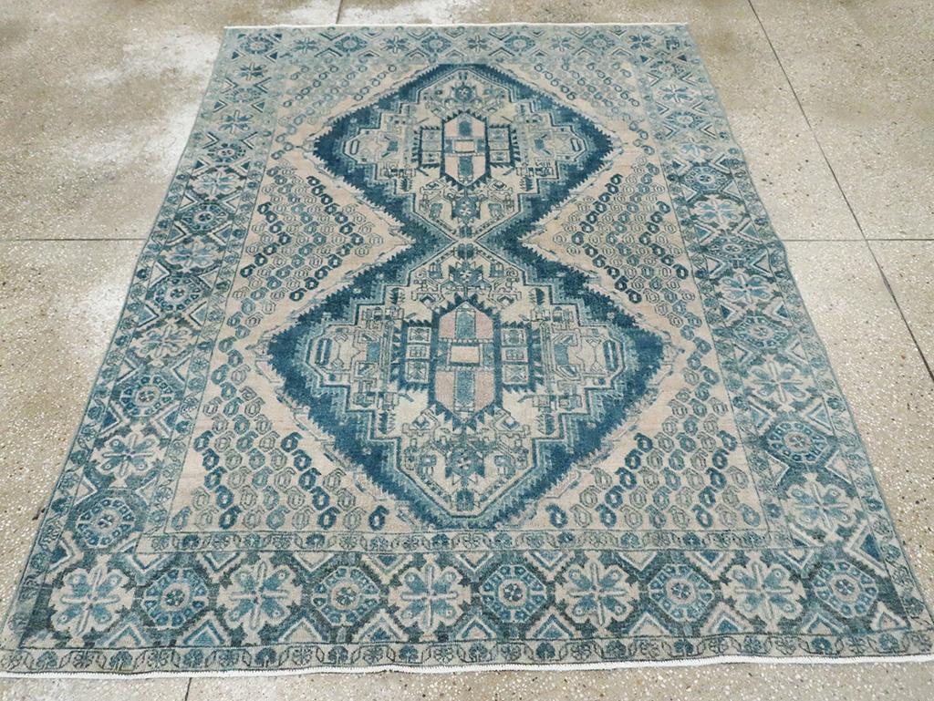 A vintage Persian Afshar accent rug handmade during the Mid-20th century.

Measures: 5' 2