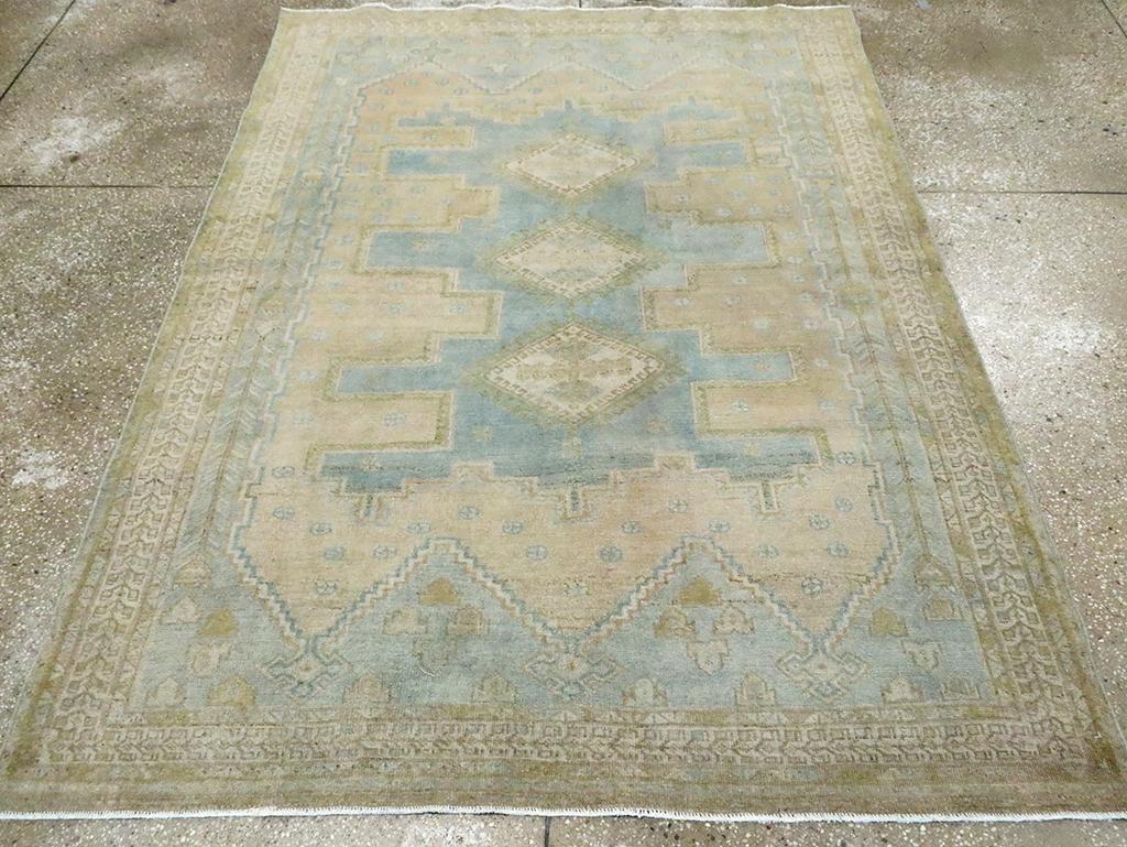 A vintage Persian Afshar accent rug handmade during the Mid-20th century.

Measures: 5' 2