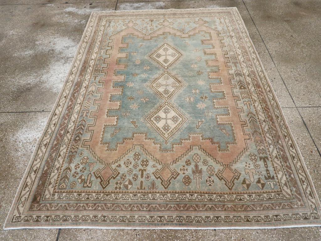 A vintage Persian Afshar accent rug handmade during the Mid-20th century.

Measures: 5' 2