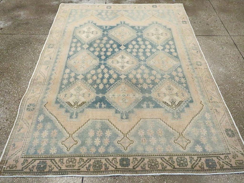 A vintage Persian Afshar accent rug handmade during the Mid-20th century.

Measures: 5' 4