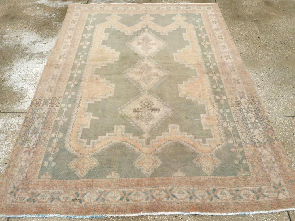 A Wool pile with symmetric knots on a cotton foundation. This group of tribal Afshar rugs is beloved for its layered cartouche pattern, centered around a sand-colored, multiply-hooked pole medallion, with three turrets at each end. The field and