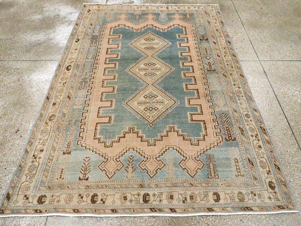 A vintage Persian Afshar accent rug handmade during the Mid-20th century.

Measures: 5' 0