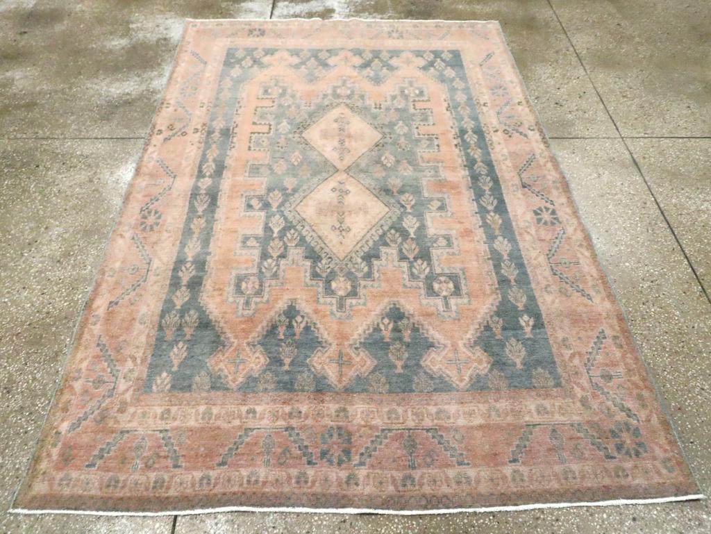 A vintage Persian Afshar accent rug handmade during the Mid-20th century.

Measures: 5' 0
