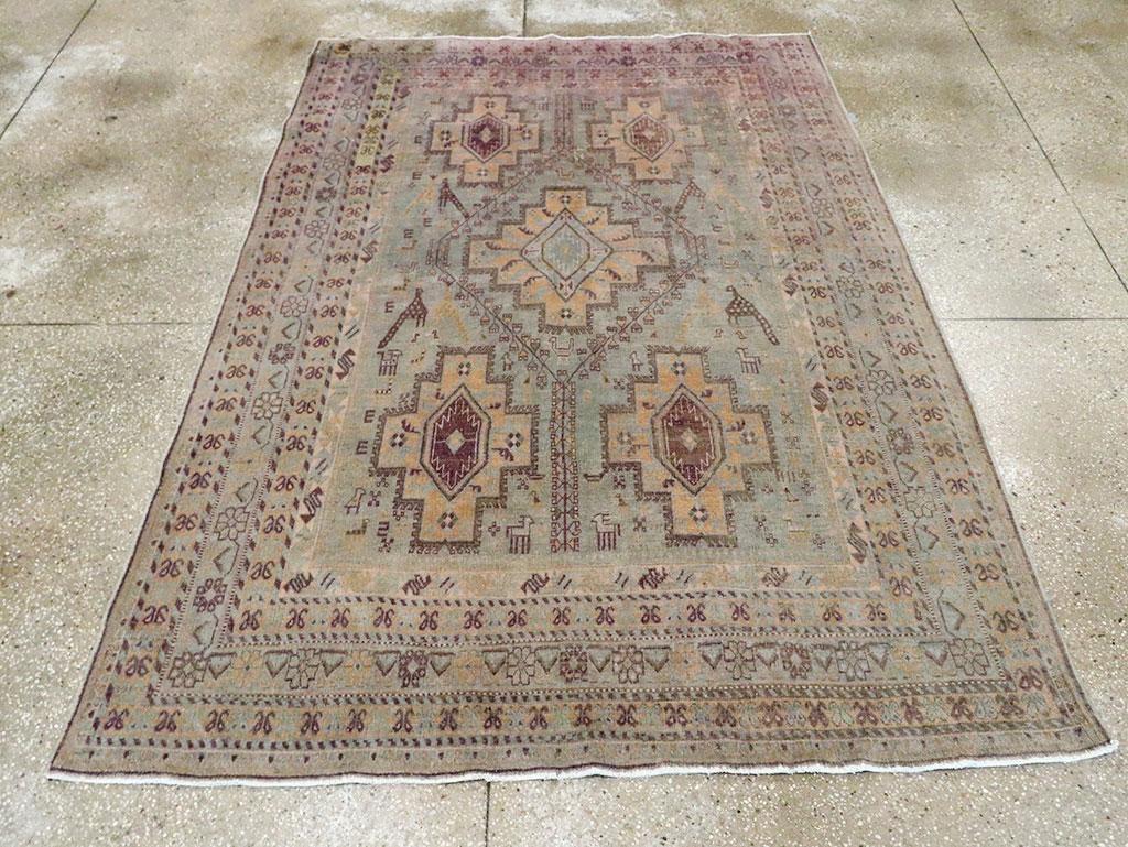 A vintage Persian Afshar accent rug handmade during the Mid-20th century.

Measures: 5' 4