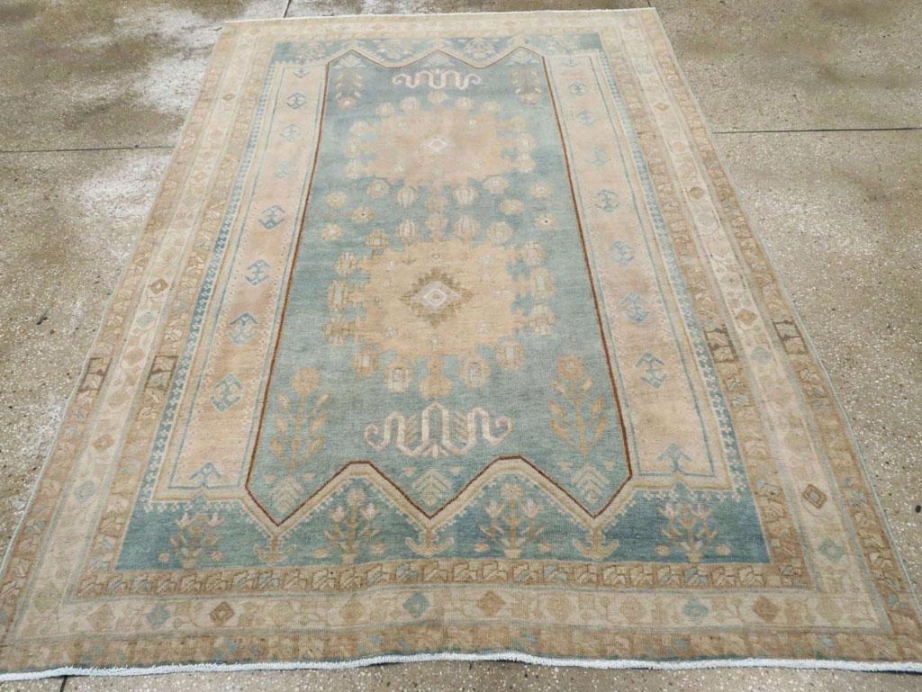 Two giant straw round medallions, each with 16 or 17 small floral pendants, totally dominate the six-pointed grey field, with snaky compressed cloud bands above and below. Buff vertical side panels. Slate field with flowers in vases along the ends.
