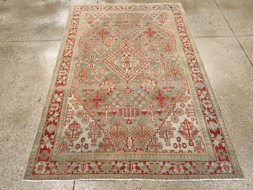 A vintage Persian Joshegan accent rug. A nested and serrated/stepped small lozenge medallion centers the brownfield of this central Persian town scatter with its characteristic small lozenge pattern of flower clusters. The ivory corners are totally