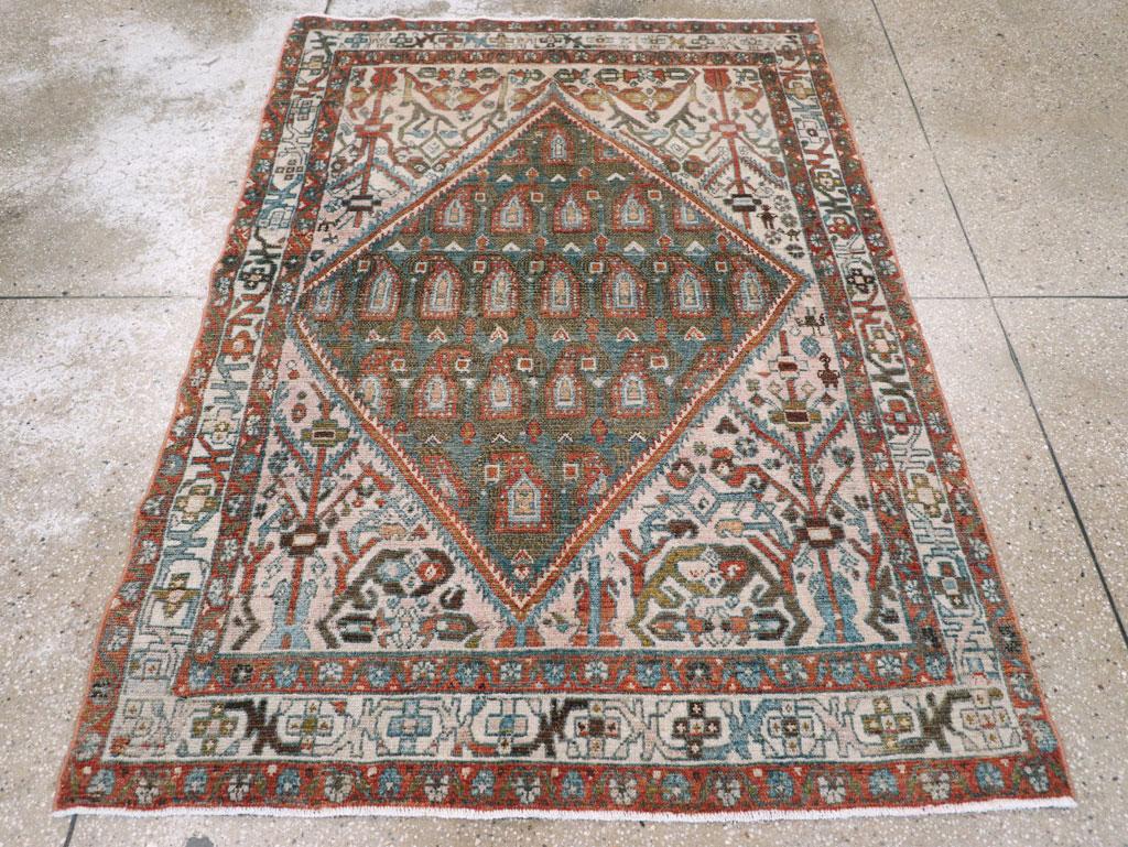 A vintage Persian Malayer accent rug handmade during the Mid-20th century.

Measures: 4' 5