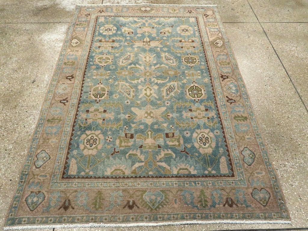 A vintage Persian Malayer accent rug handmade during the Mid-20th century.

Measures: 4' 5