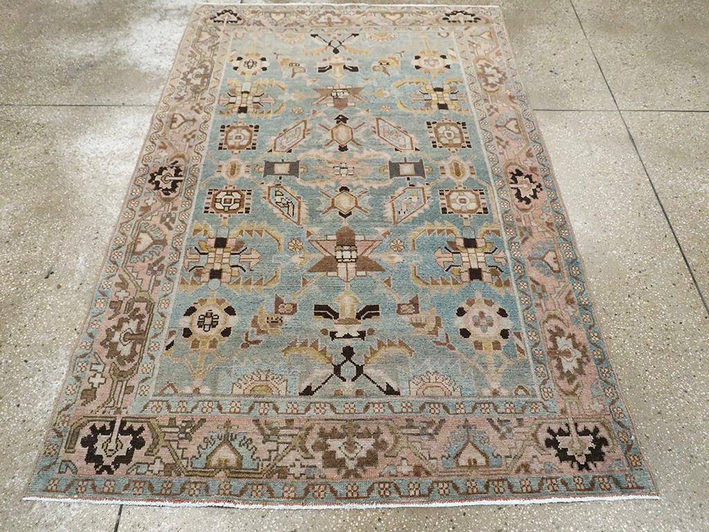 A vintage Persian Malayer accent rug handmade during the Mid-20th century.

Measures: 4' 5