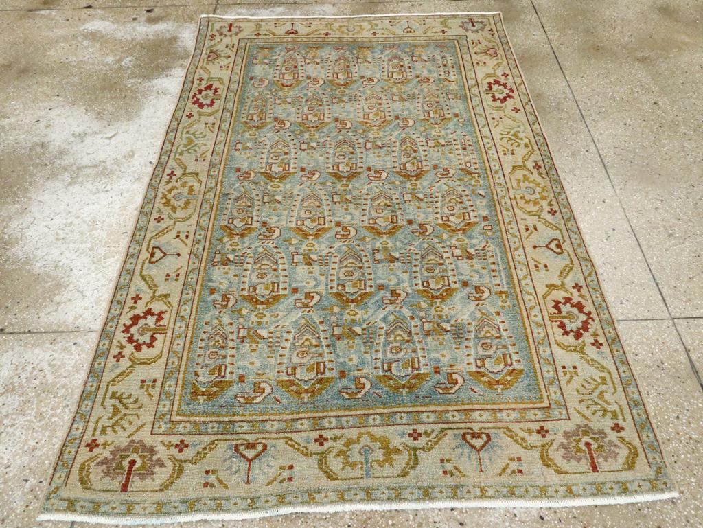 A vintage Persian Malayer accent rug handmade during the Mid-20th century.

Measures: 4' 5