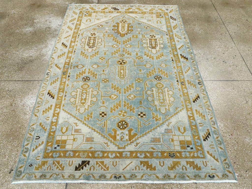 A vintage Persian Malayer accent rug handmade during the Mid-20th century.

Measures: 4' 5